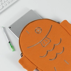 Macro detail of cute orange fish-shaped tablet sleeve with high-quality embroidery