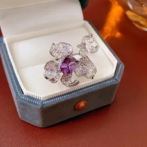 Luxury floral open ring featuring a rectangular purple zircon and pavé crystal petals