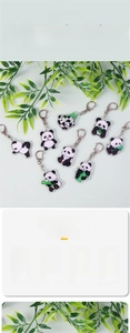 Detail view of acrylic panda keychains featuring various poses and metal D-ring clips