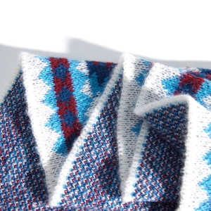 Ethnic style knitted shawl with blue red and white geometric jacquard pattern wrap