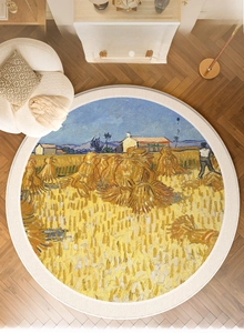Detail of round rug with Van Gogh wheat field pattern on herringbone wooden floor