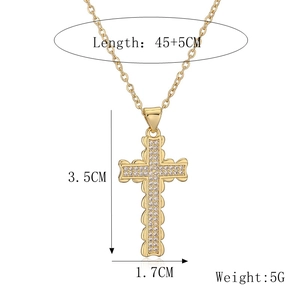 Detailed view of gold cross pendant with dimensions and white zircon stone setting