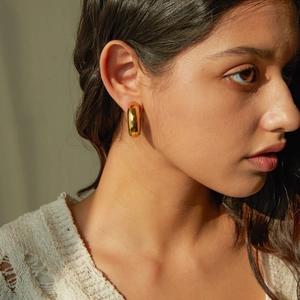 Minimalist 16k gold plated stainless steel chunky C-shaped hoop earrings on female model