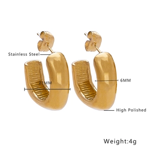 Close-up of high polished gold plated stainless steel U-shaped wide hoop earrings