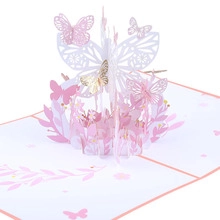 Detailed 3D pop-up birthday card featuring pink paper butterflies and gold floral accents
