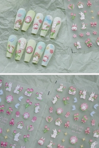 Detail of embossed matte 3D nail stickers with cute pink rabbits and tulip floral designs