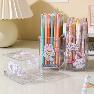 Minimalist transparent acrylic pen holder with cute stickers on a cozy desktop
