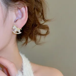 Sparkling cubic zirconia rocking horse stud earring in gold-plated alloy for women