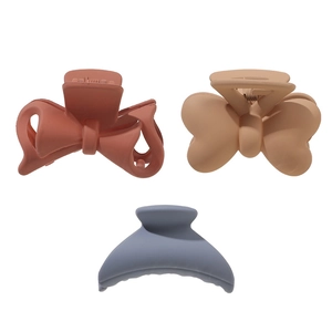 Matte finish small bow hair clips in brick red, khaki, and foggy blue colors