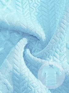 Close-up of light blue polo shirt fabric featuring premium jacquard diamond texture