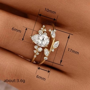 Japanese style leaf branch ring set with pear-shaped zircon and golden vine design