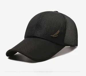 Detail of black mesh baseball cap featuring a golden feather metal logo on the side
