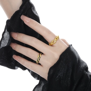 Minimalist S925 sterling silver knot rings in gold and black on model hand