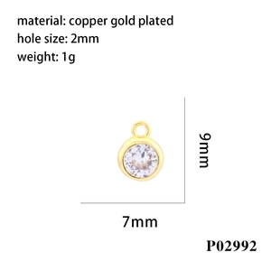 Macro shot of 9mm copper gold plated round zircon pendant with 2mm hole size measurements