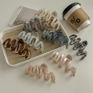 Elegant marble pattern acetate hair claws with gold metal teeth in various colors