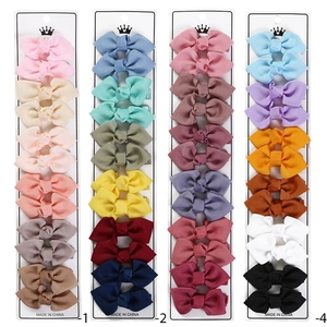 Set of colorful grosgrain ribbon bow hair clips for kids on display cards