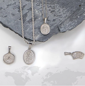 Detailed view of silver stainless steel pendants with star, heart, and angel icons