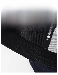 Detailed macro view of the wide sweatband and FBXS label inside a dark baseball cap