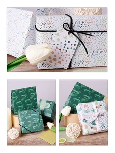 Detail showing cartoon jungle animal and polka dot patterns on gift wrapping paper sets