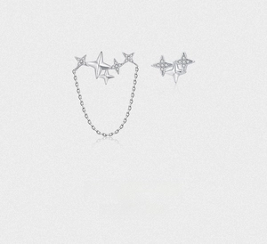 Macro shot of 925 sterling silver star earrings with zircons and chain detail