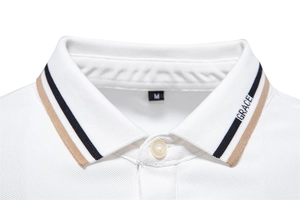 Close-up of white cotton Polo collar showing pique texture, buttons and size M label