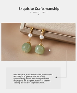 Detailed close-up of vintage earrings featuring fresh water pearl and green jadeite