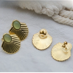 Detailed macro view of gold-plated 304 stainless steel shell-shaped stud earrings