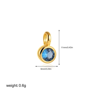 Detailed view of 18K gold pendant with blue zircon showing 11mm height and 6mm width