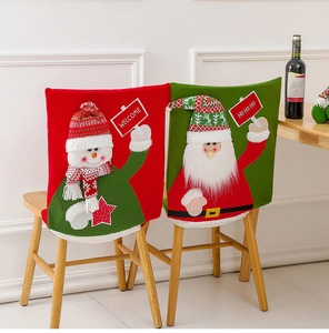 Detailed view of knitted Santa and Snowman chair covers with festive Welcome text