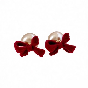 Elegant red velvet bow earrings with champagne pearls and cubic zirconia stones