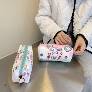 Close-up of a cute canvas pencil case showing the smooth zipper and rabbit print