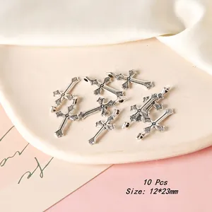 Detailed view of 10 vintage silver cross charms for DIY jewelry making, 12x23mm size