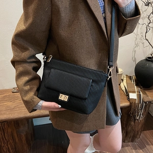 Minimalist black pleated shoulder bag with gold clasp and premium PU leather texture