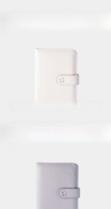 Close-up of litchi texture leather passport holders with metal airplane snap button