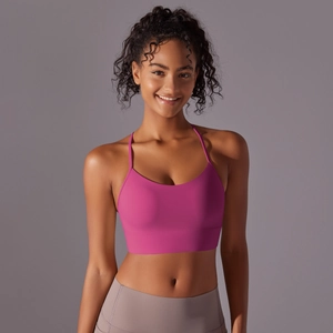 Detailed front view of hot pink racerback sports bra with thin straps and wide hem
