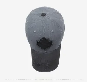 Overhead view of vintage washed cotton baseball cap with maple leaf patch and distressed edge