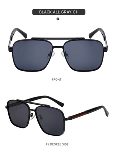 Close-up of black aviator sunglasses with a double bridge and dark grey lenses