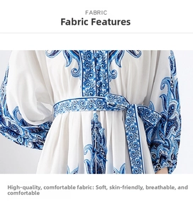 Detail of blue paisley print and waist tie on a lightweight chiffon mini dress