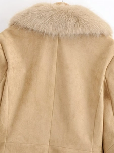 Detail of the back stitching and plush faux fur collar on a khaki suede jacket
