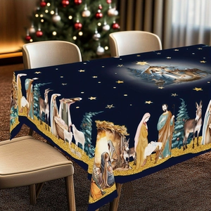 Detailed close-up of dark blue Christmas tablecloth featuring Nativity scene and stars