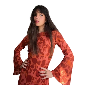 Detail view of the orange floral printed dress with elegant flared sleeves and round neck