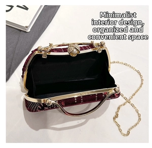 Detail view of burgundy sequined clutch bag interior with elegant pearl and rhinestone clasp