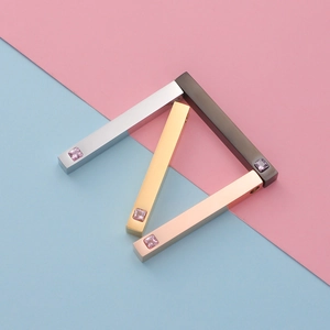 Polished rectangular stainless steel pendants with crystal inlay in four metallic finishes