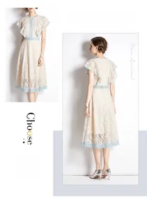 Detailed view of floral lace pattern on high waist A-line dress with flutter sleeves