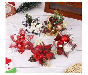 Detailed view of assorted Christmas picks with festive berries, pine needles and plaid bows