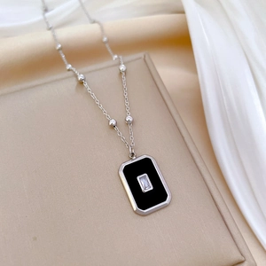Minimalist silver bead chain necklace featuring a black rectangular pendant with zircon stone