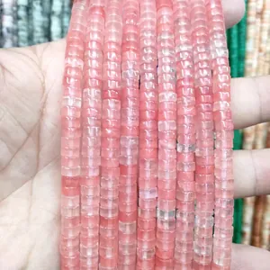 Macro shot of natural pink strawberry quartz spacers with smooth translucent texture