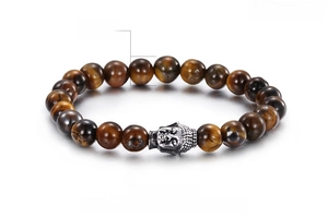 Detail view of 8mm tiger eye beads and metal Buddha head charm on the beaded bracelet