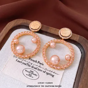 Elegant 18K gold plated hoop earrings with pink crystals and pearls in vintage style
