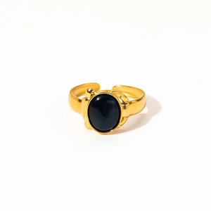 Detailed close-up of a gold-plated open ring featuring a polished oval black stone inlay